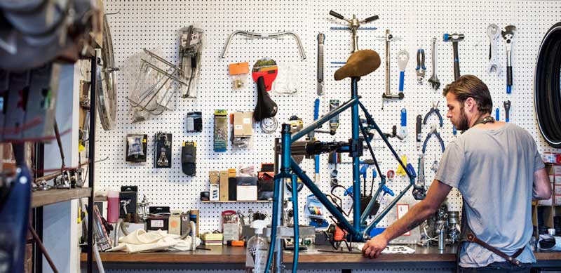 Man fixing bicycles